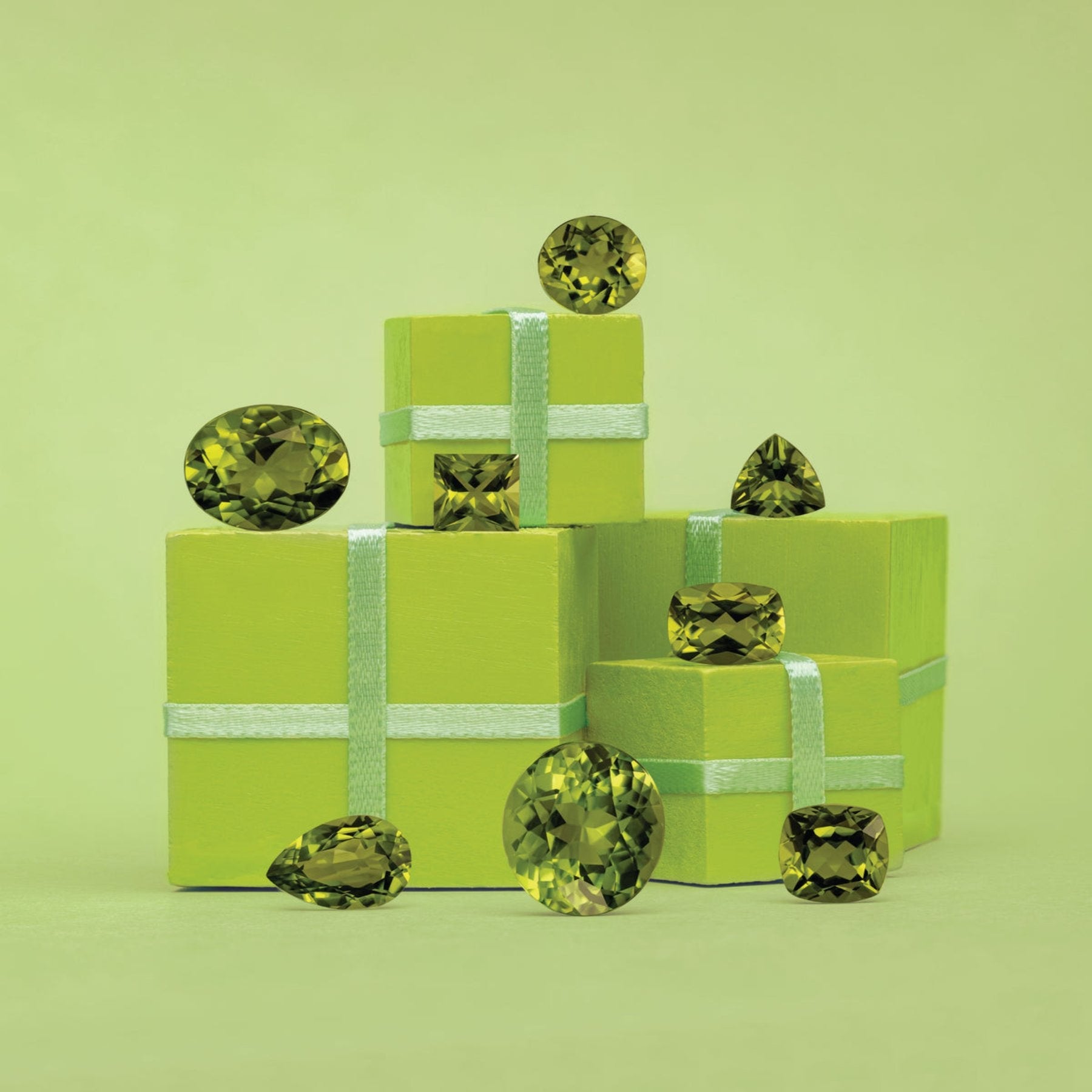 Peridot gemstones on green boxes